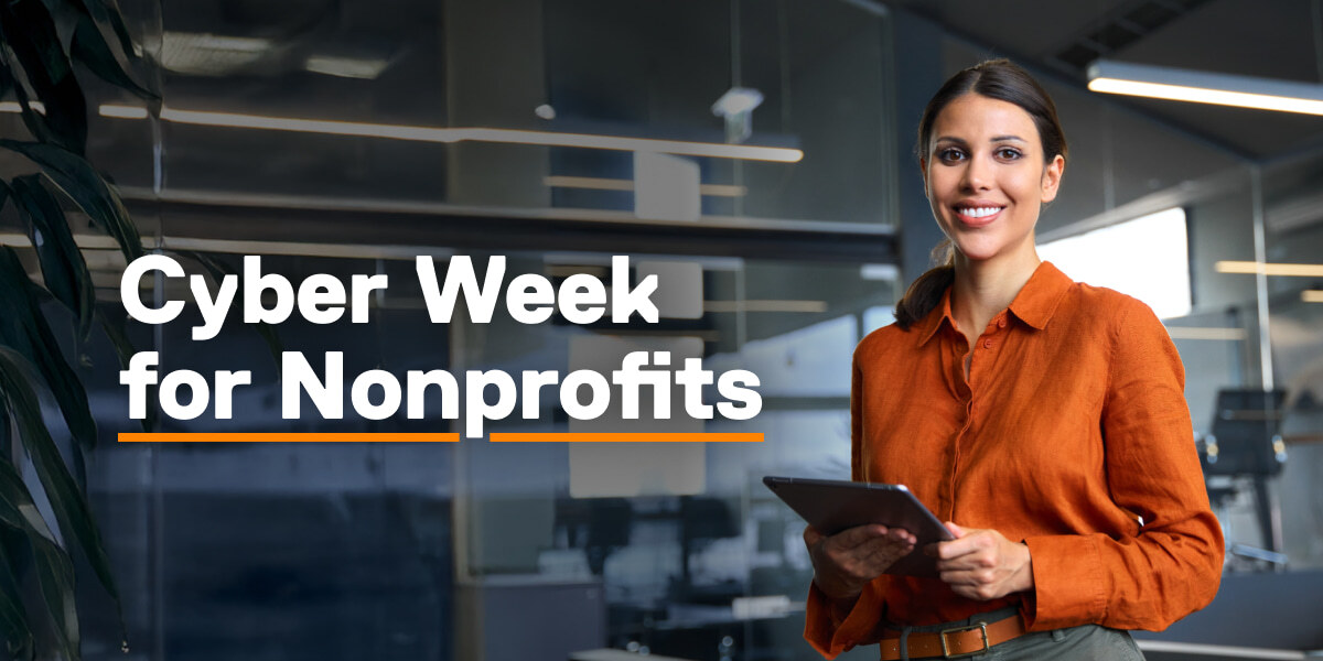 Photo of a smiling office worker with the text, "Cyber Week for Nonprofits."