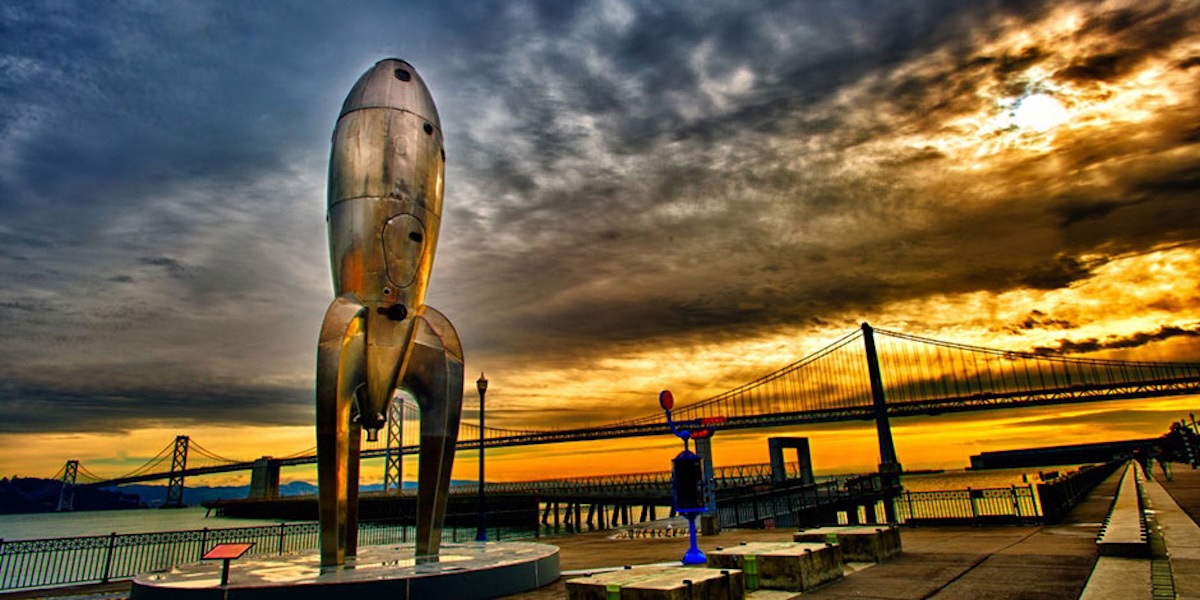 Photo of a rocketship art installation along the San Francisco Bay.